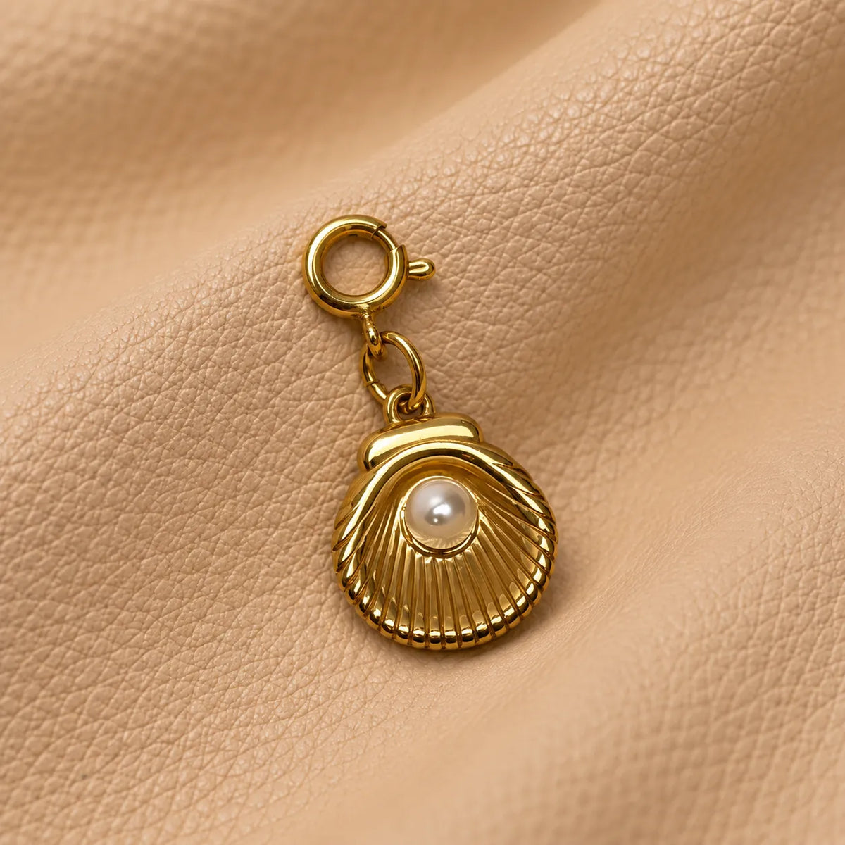 Small journal accessory featuring a delicate charm bead attached to the notebook cover.