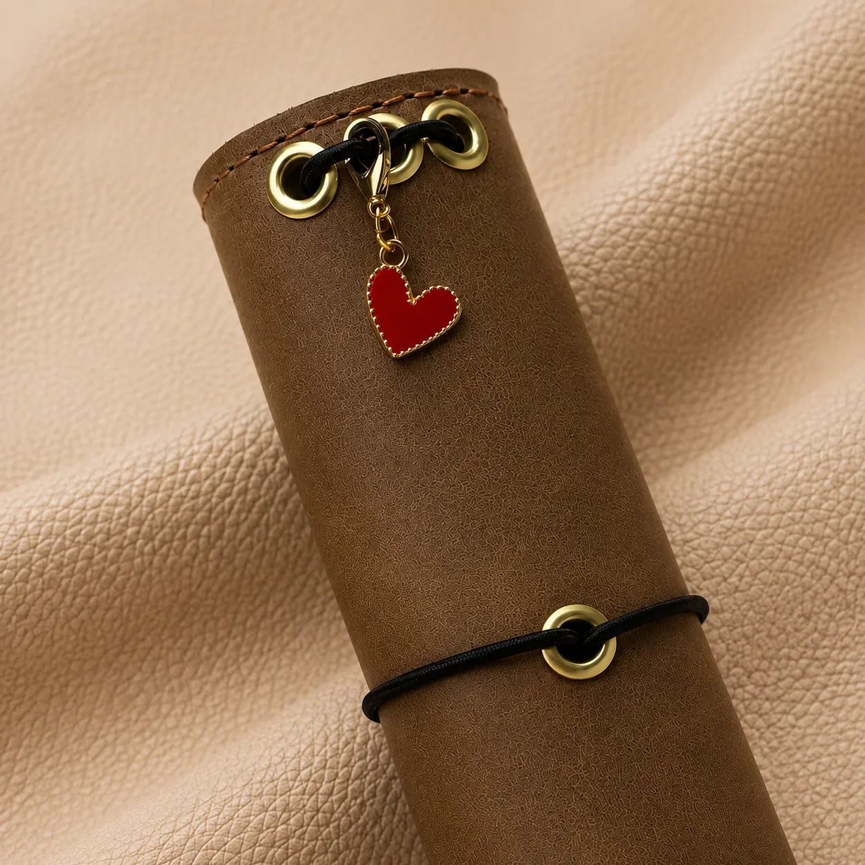 Heart-shaped journal charm with decorative bead for leather notebook personalization