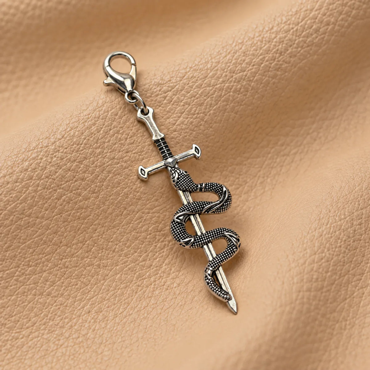 Stylish beaded charm adorning a leather notebook with an elegant hanging design.