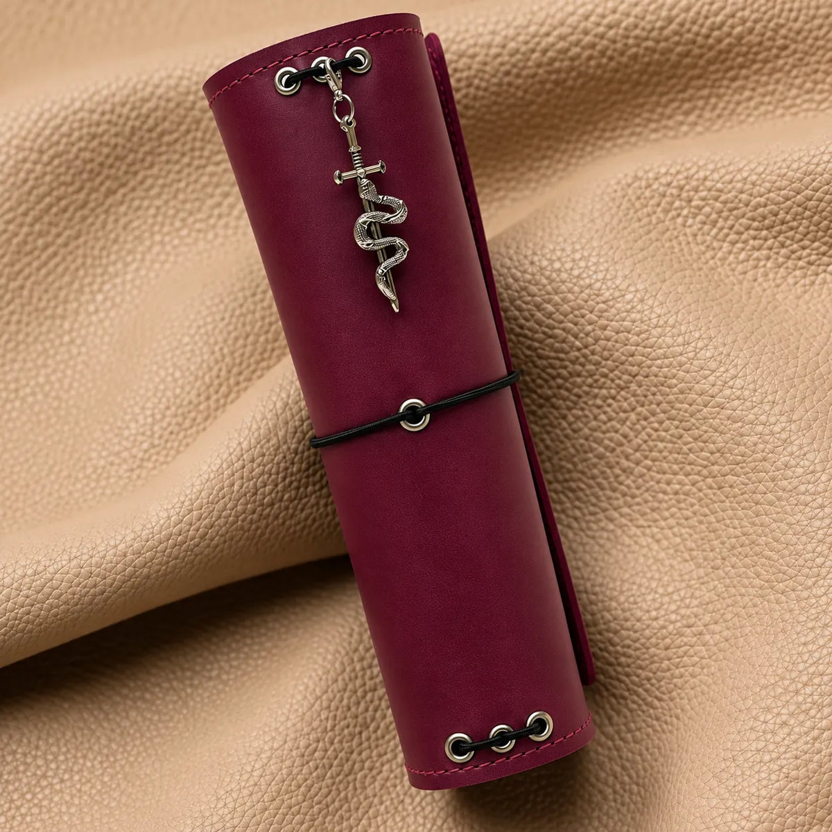 Stylish beaded charm adorning a leather notebook with an elegant hanging design.
