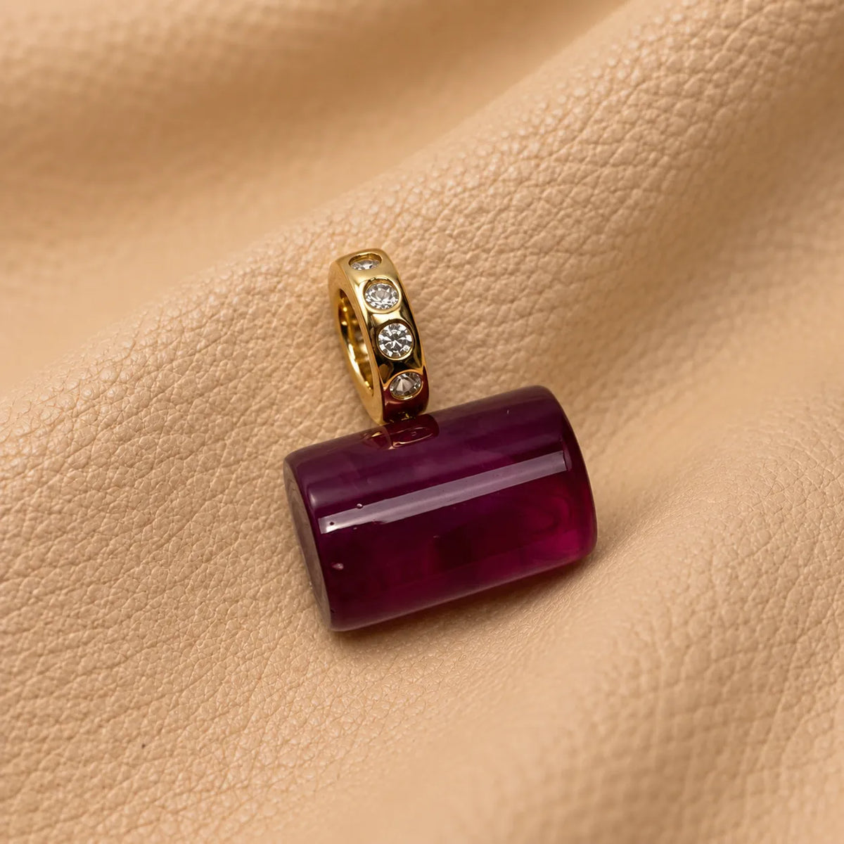 Stylish bead accessory hanging from a journal elastic for an elegant appearance.