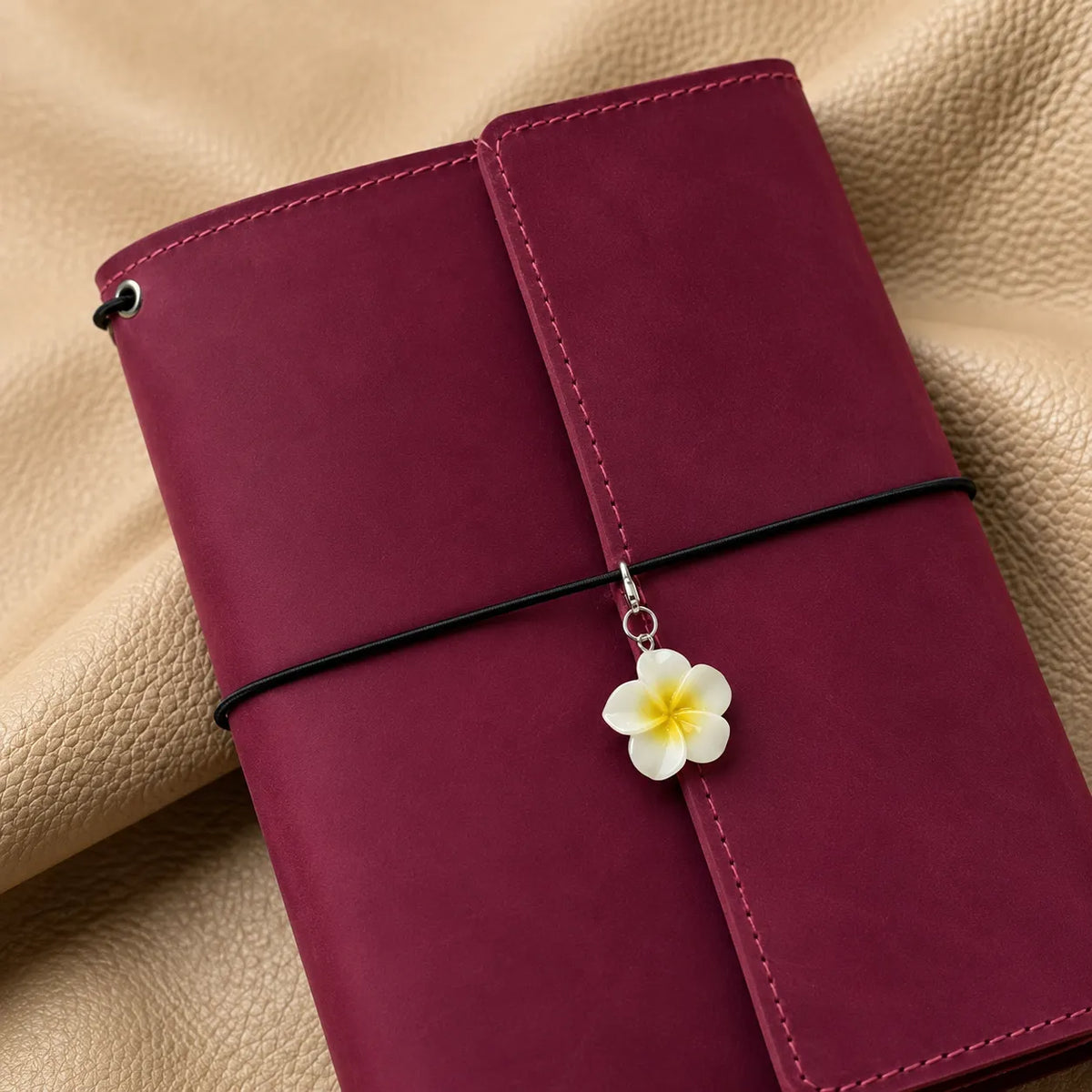Beautiful decorative bead attached to a notebook cover as an elegant journal accessory.