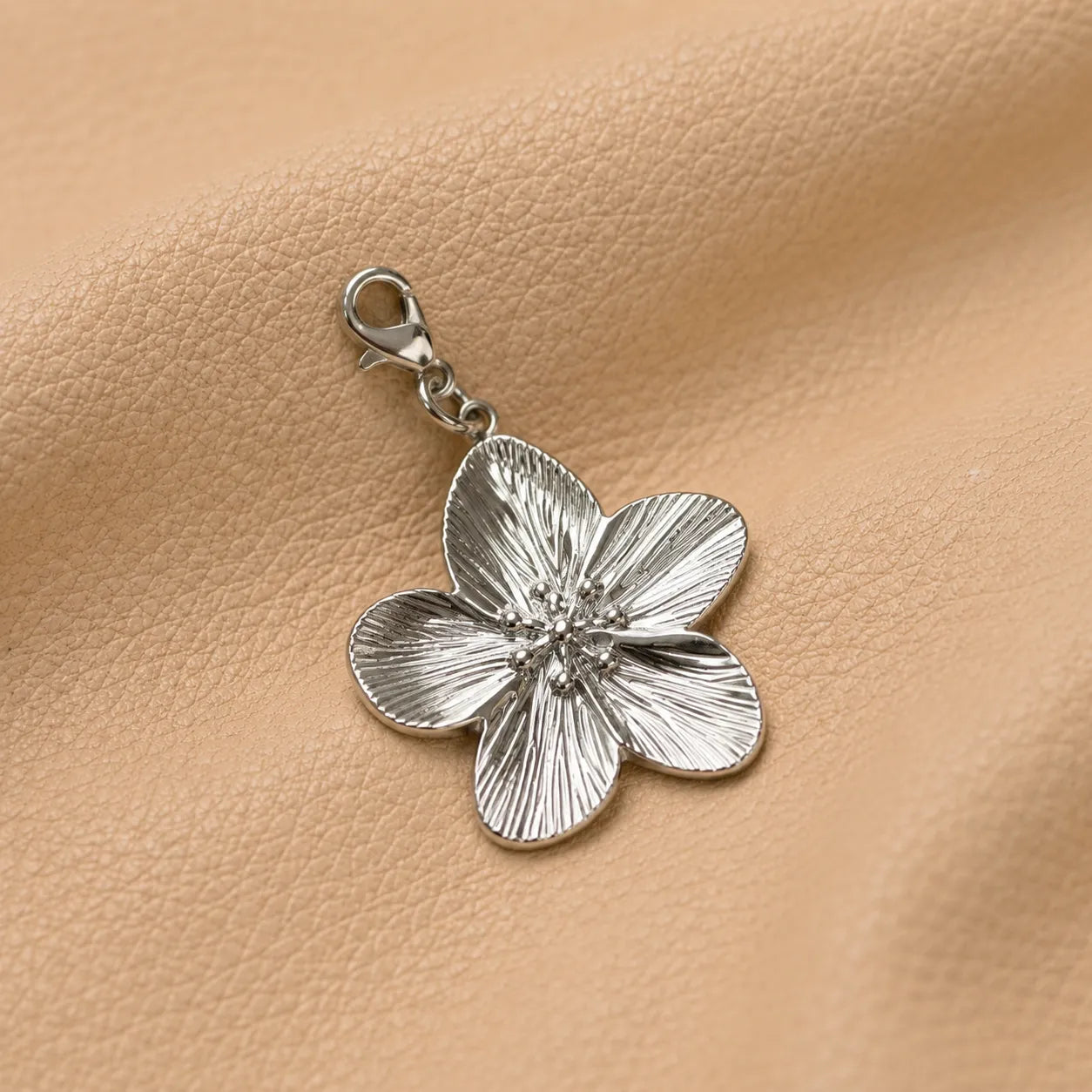 Close-up of a floral notebook charm bead, stylish journal decoration for travelers notebook