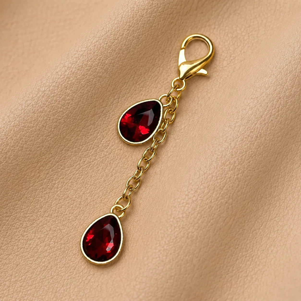 Genuine leather journal charm with gemstone beads attached to notebook elastic band.