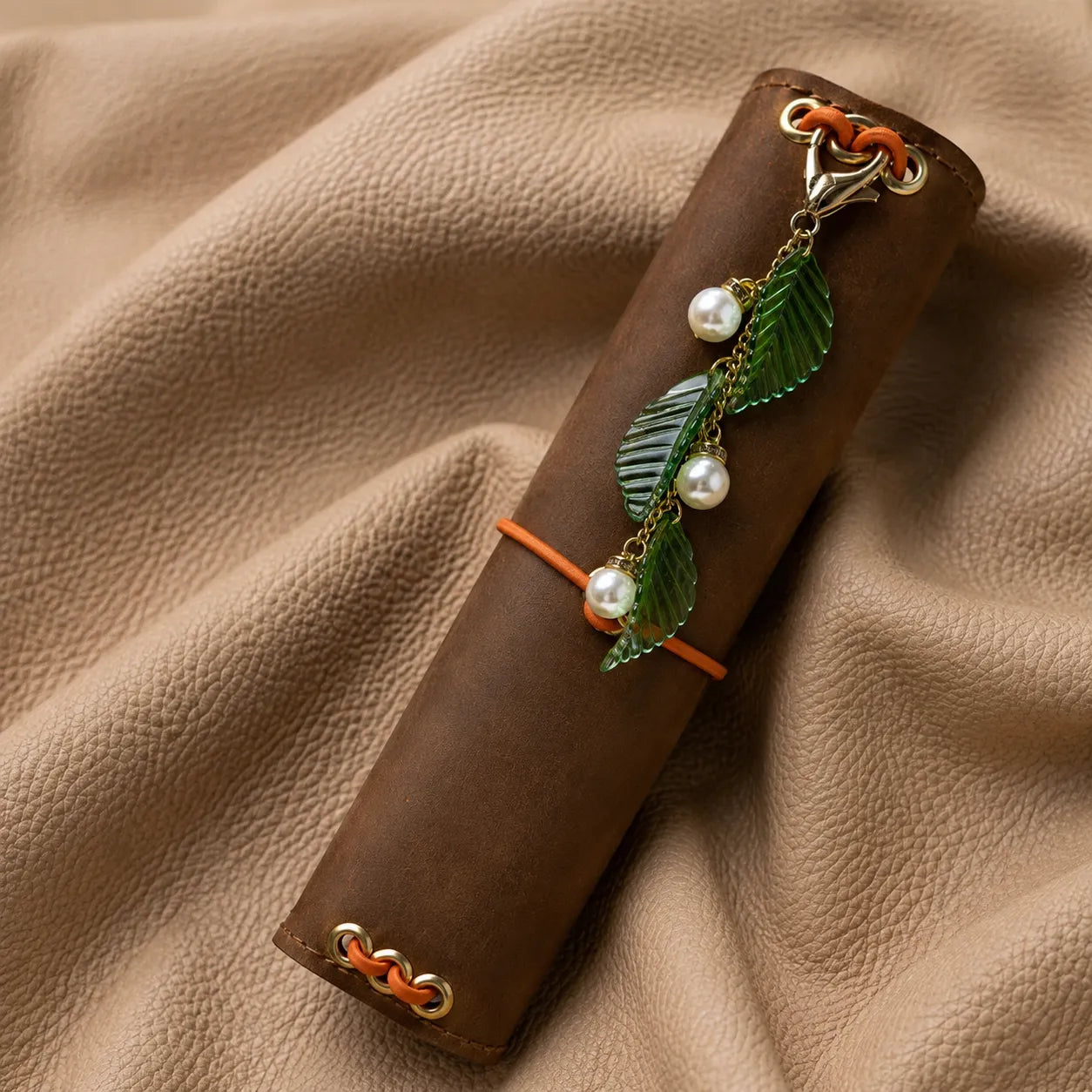 Decorative leaf notebook charm with metal clasp, stylish accessory for elastic journal covers.