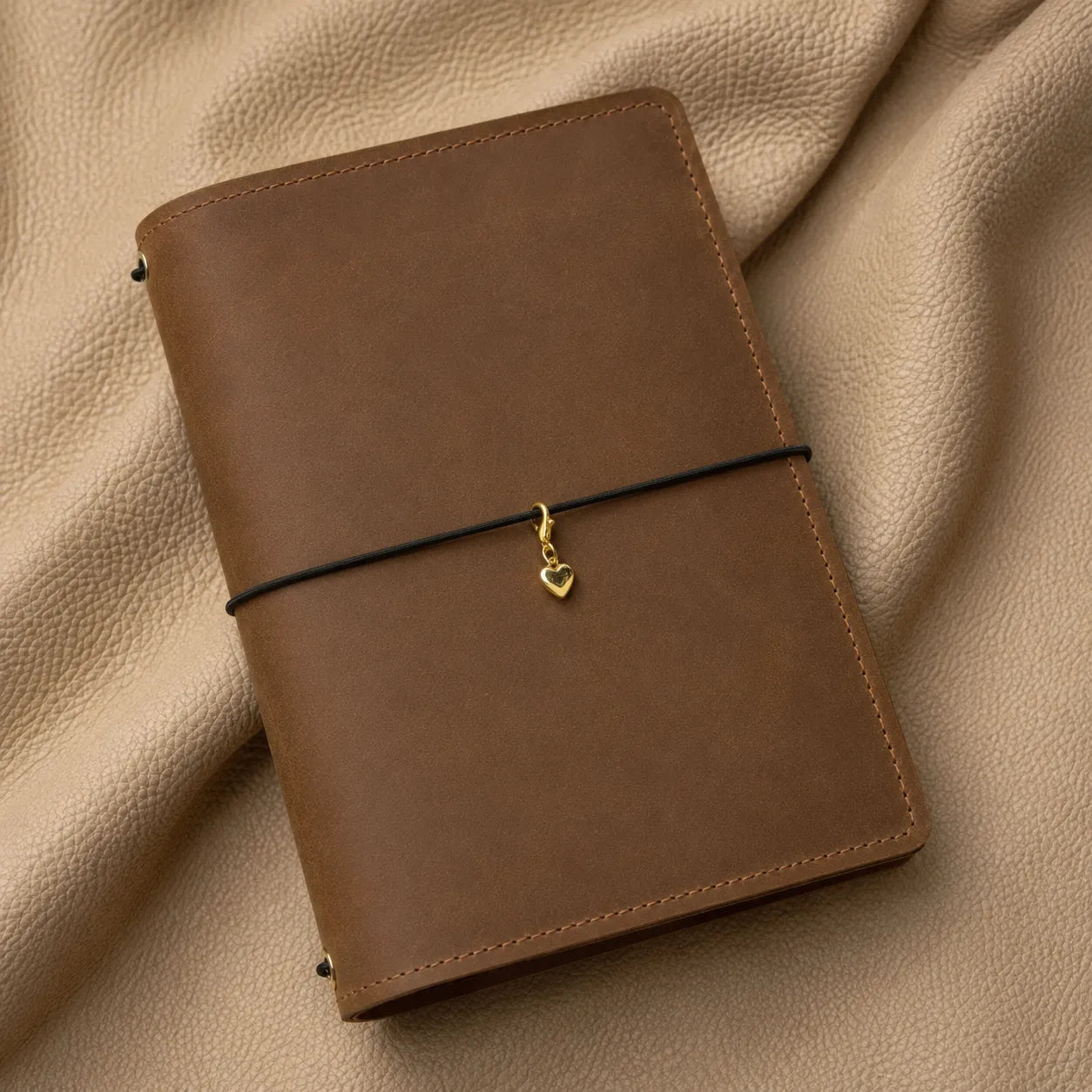 Decorative heart journal charm for notebook elastic bands, handcrafted accessory with durable metal clasp.
