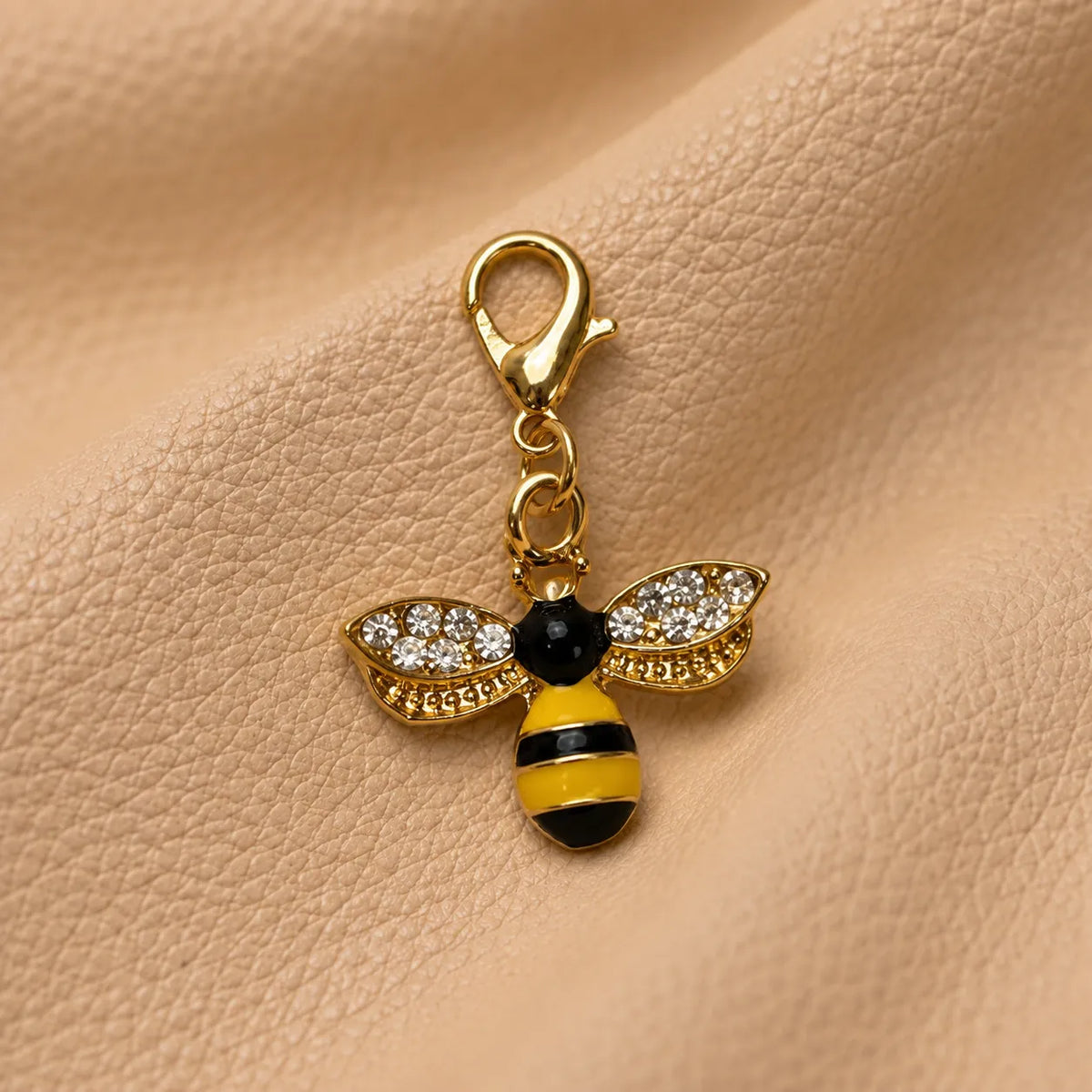 Elegant bead accessory attached to a journal elastic for a refined decorative look.