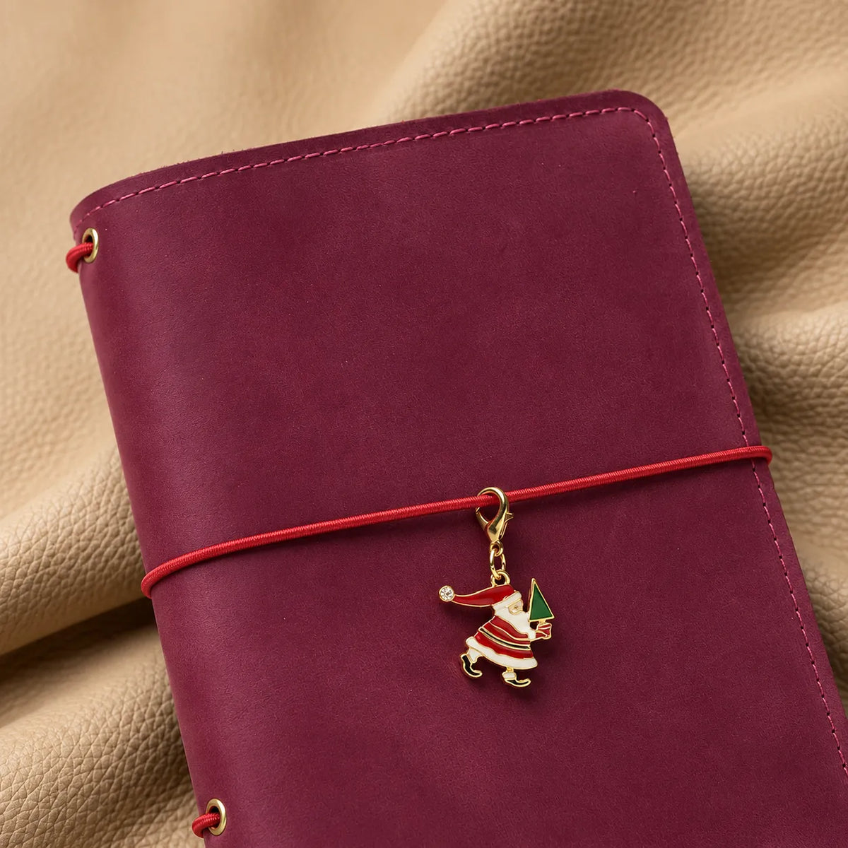 Beautiful bead charm attached to a leather journal for a stylish finishing touch.