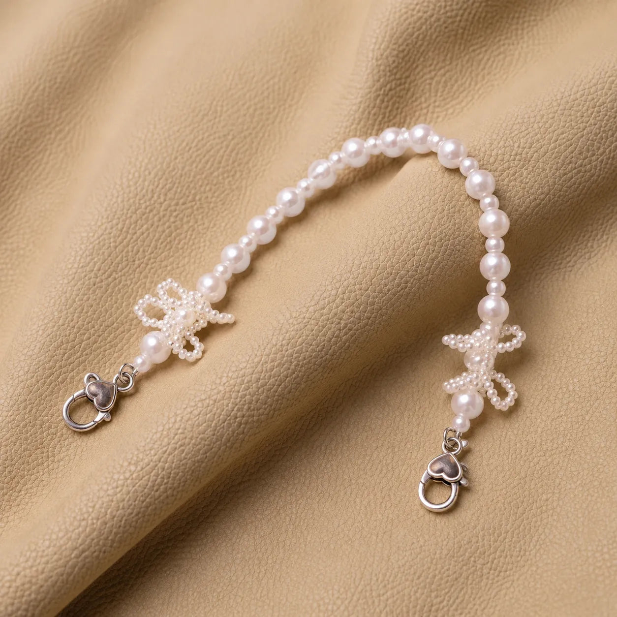 Beaded journal charm handle with metal attachment for notebook cover.