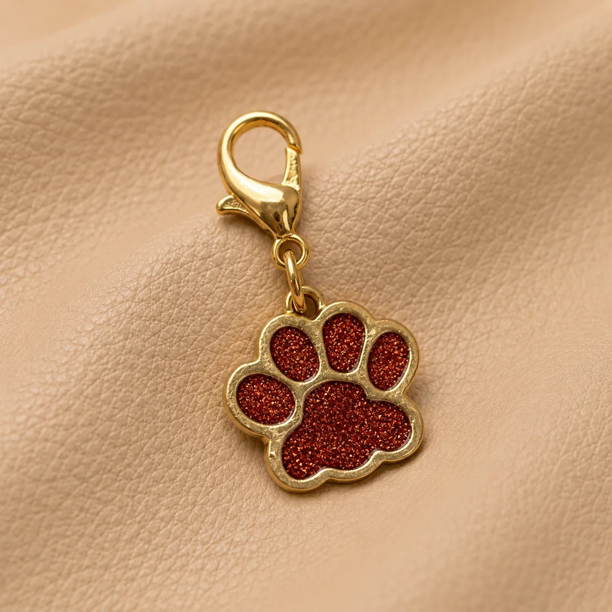 Cute cat paw notebook charm decorating elastic bands, stylish journal accessory with secure metal fitting.