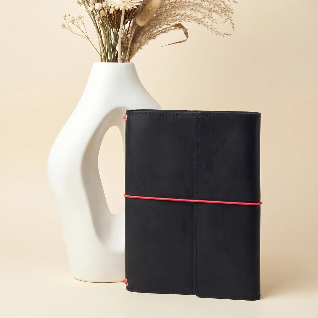 Leather notebook cover with elastic bands and artisan handmade craftsmanship for daily use