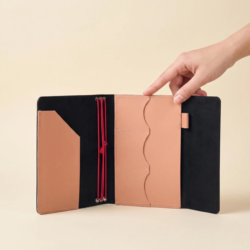 Refillable leather notebook organizer with elastic bands, pockets, and pen loop