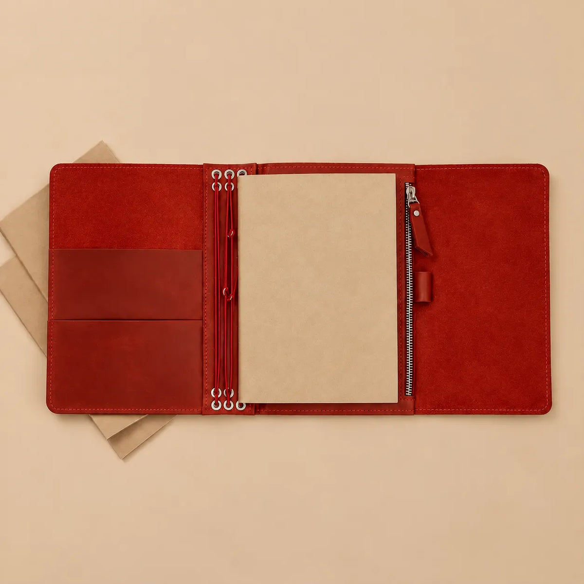Red leather notebook organizer with six elastic bands, multiple pockets, large zipper pocket, and pen loop.