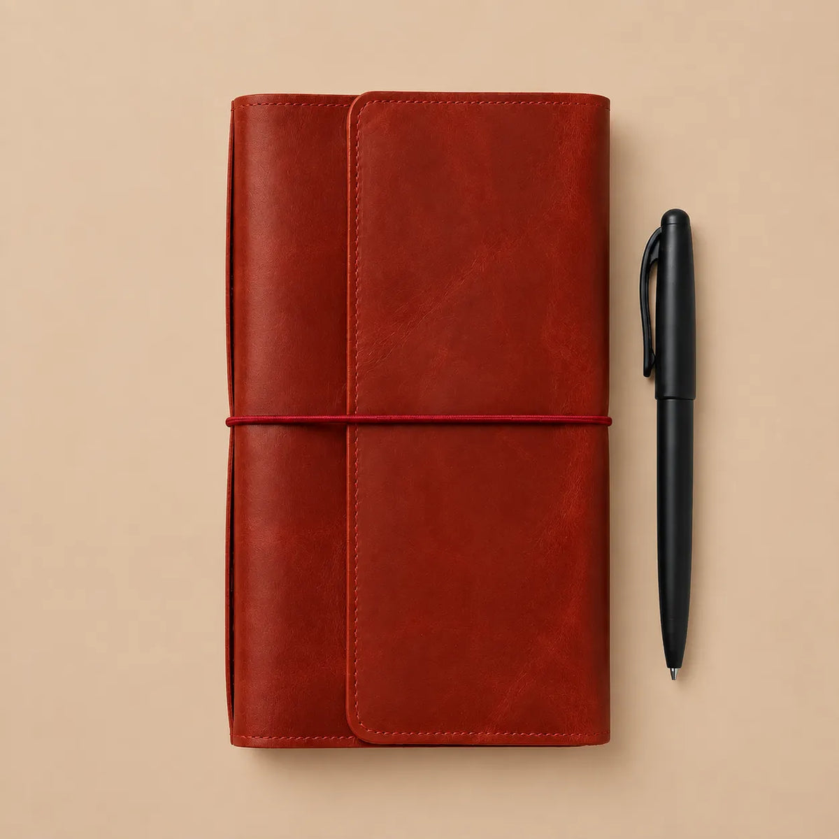 Red leather planner cover featuring six elastic bands, interior pockets, large zipper pocket, and pen holder.