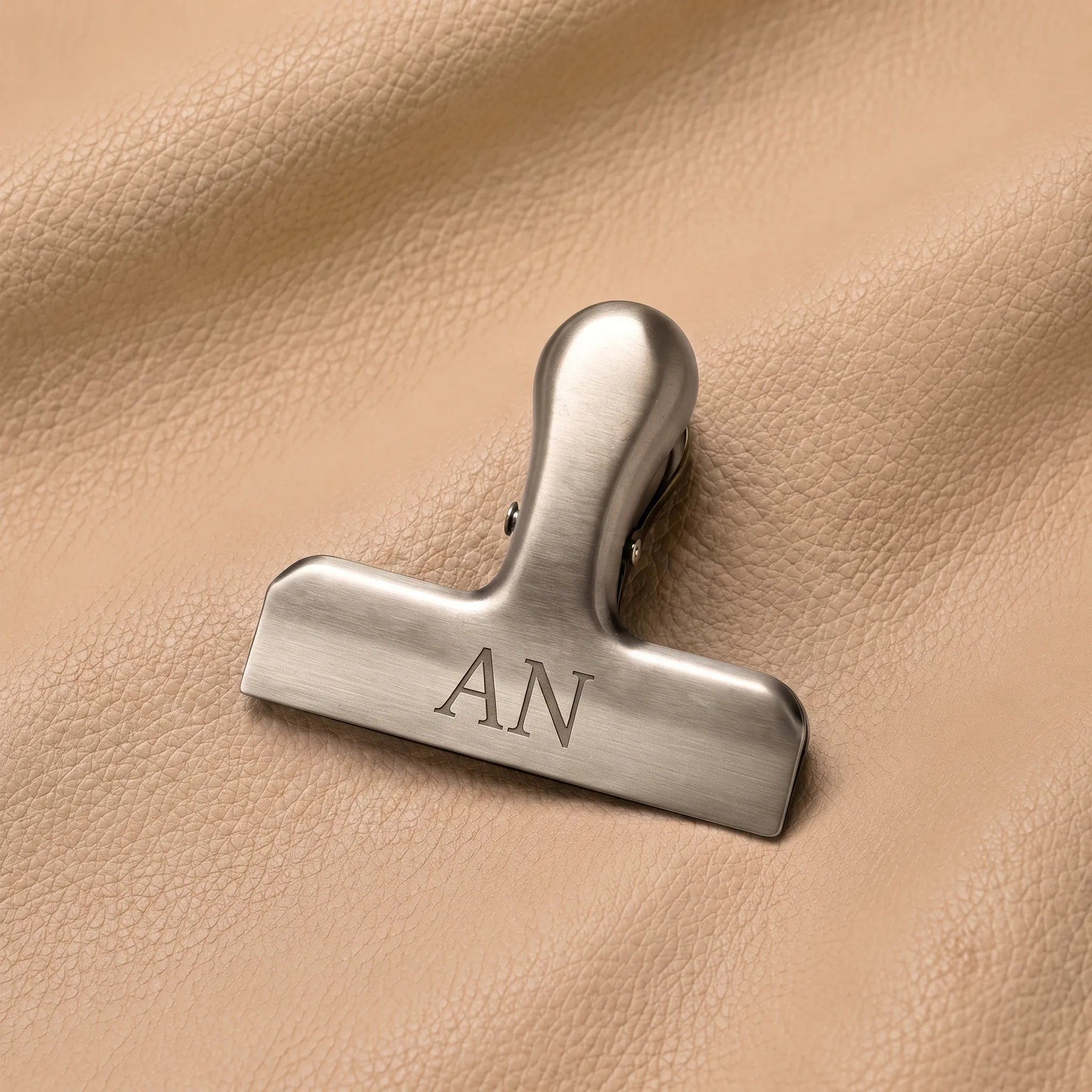 Silver nameplate bookmark clip for leather journals — detail