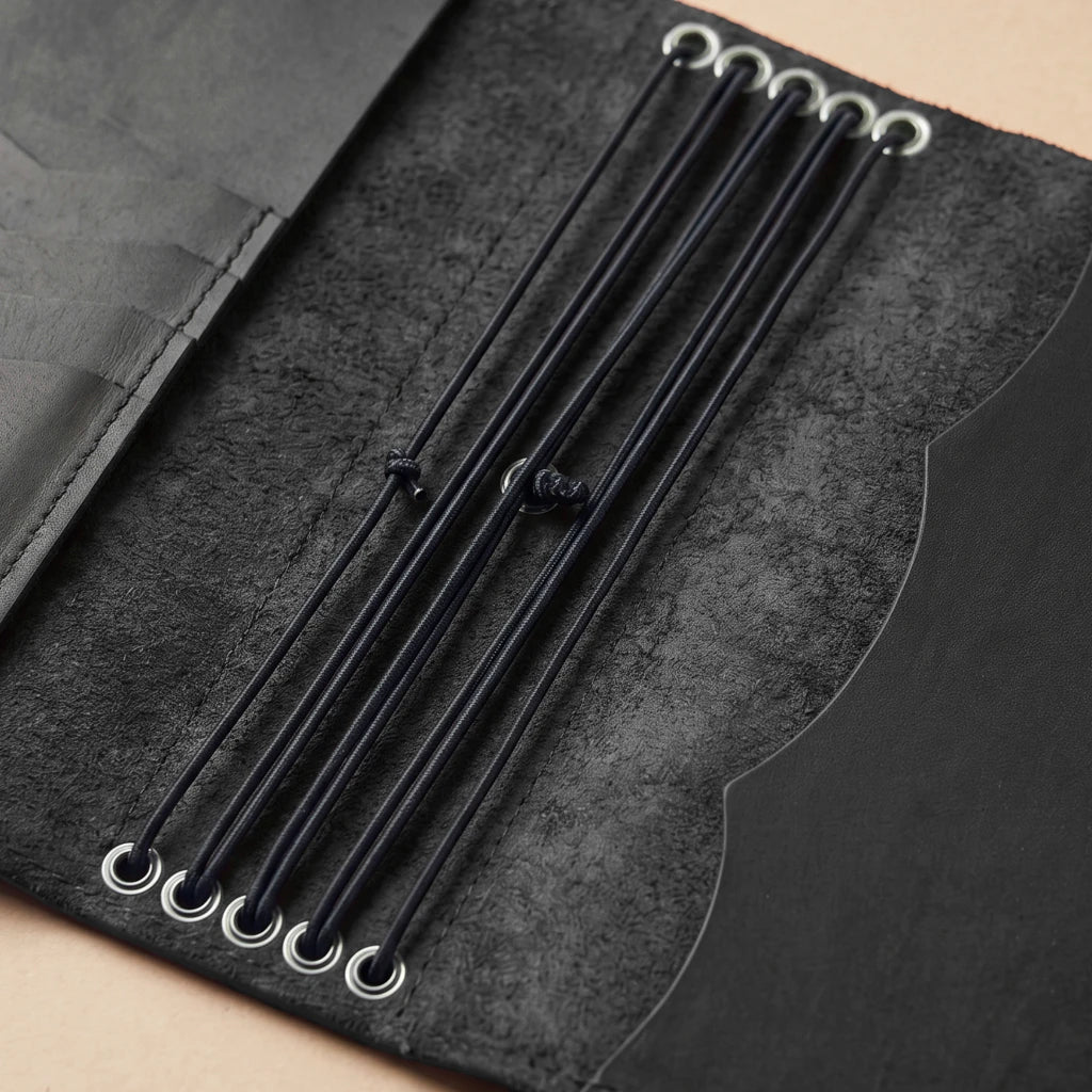Durable leather notebook cover designed with pockets and pen holder
