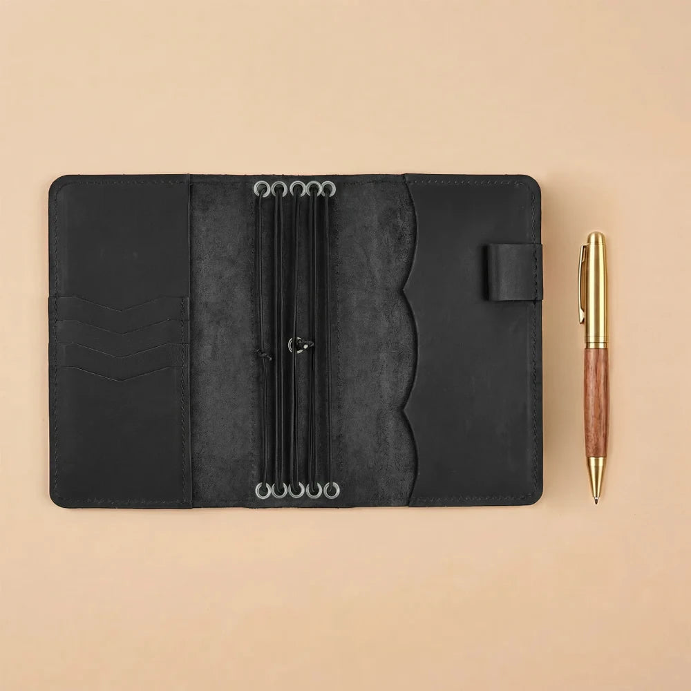 Handmade refillable notebook cover crafted from genuine leather with elastic holders inside.