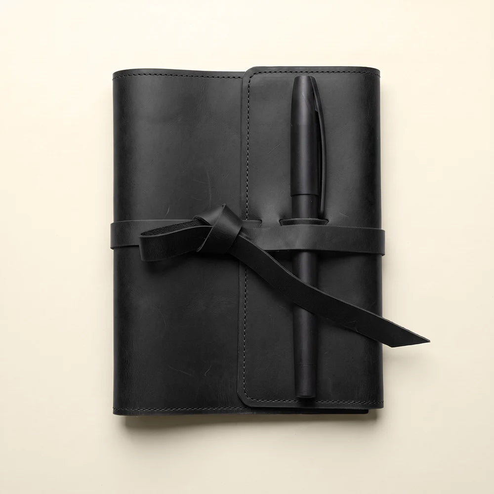Rustic leather notebook cover featuring practical pockets and elastic pen holder.