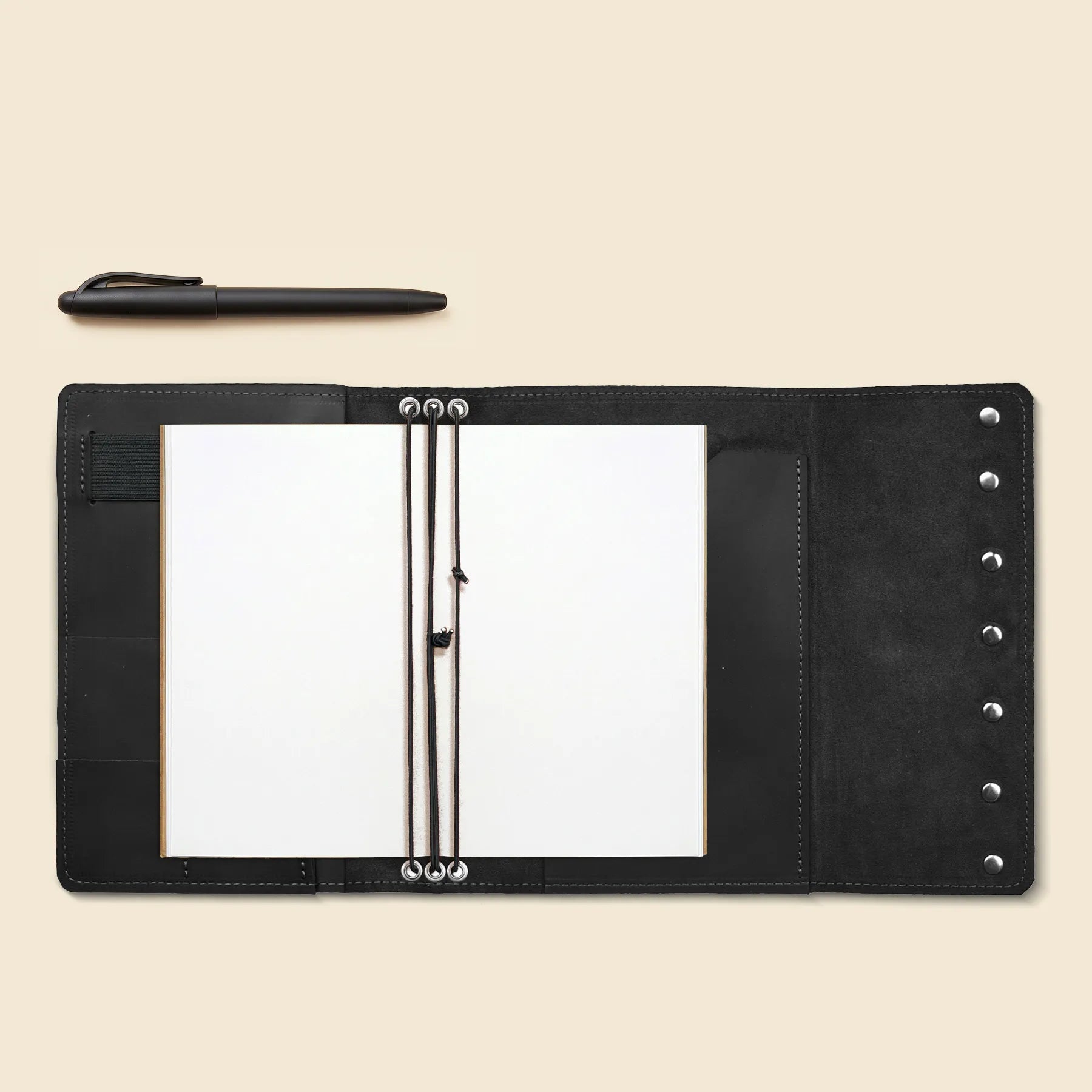 Handmade journal cover crafted from full-grain leather with organizer pockets.