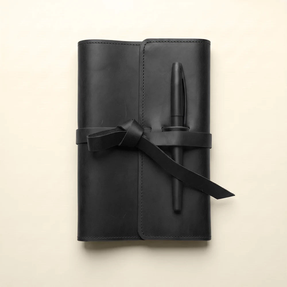 Premium refillable notebook cover with leather pockets and dedicated pen loop.