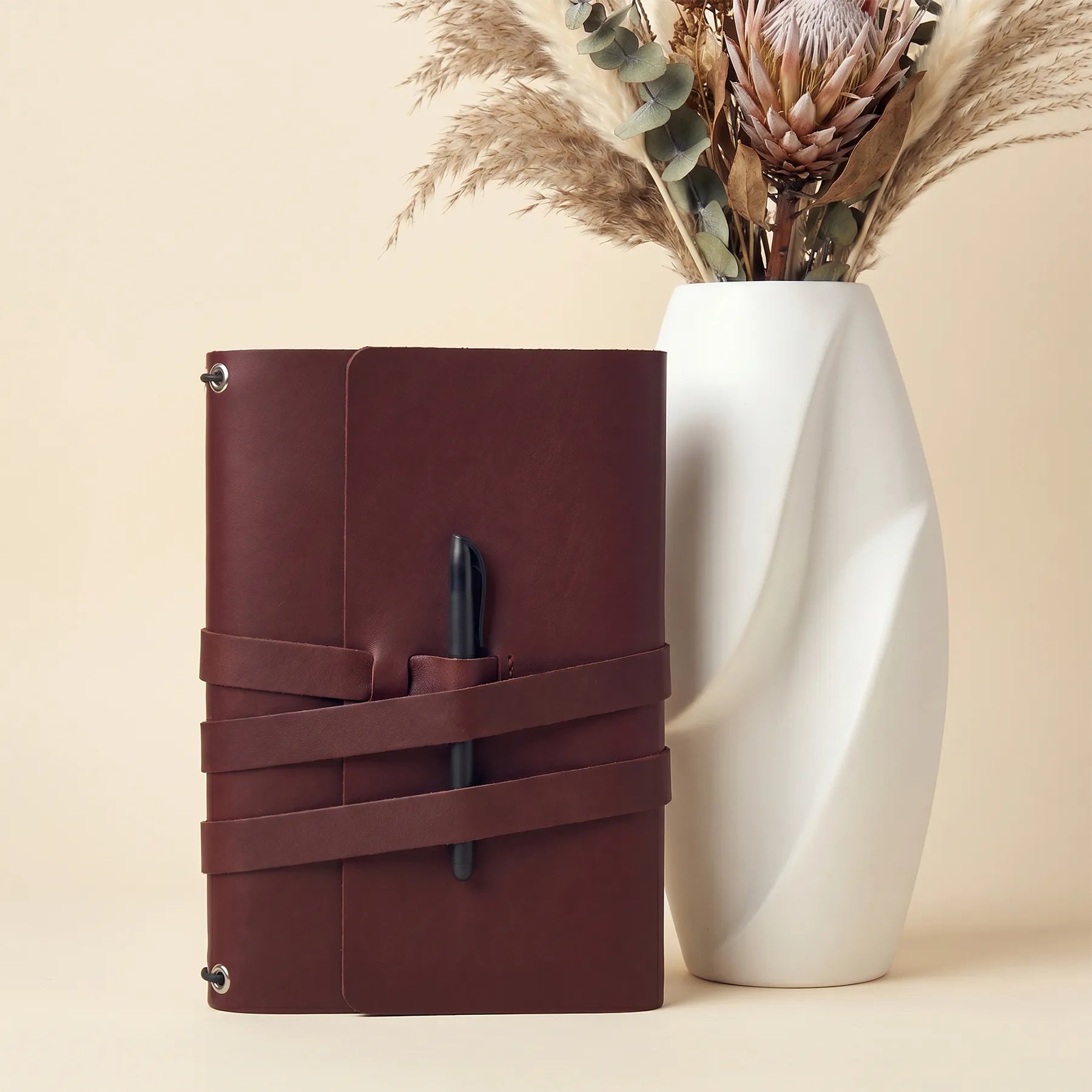 Durable leather journal cover handcrafted with convenient pen holders and premium leather finish.