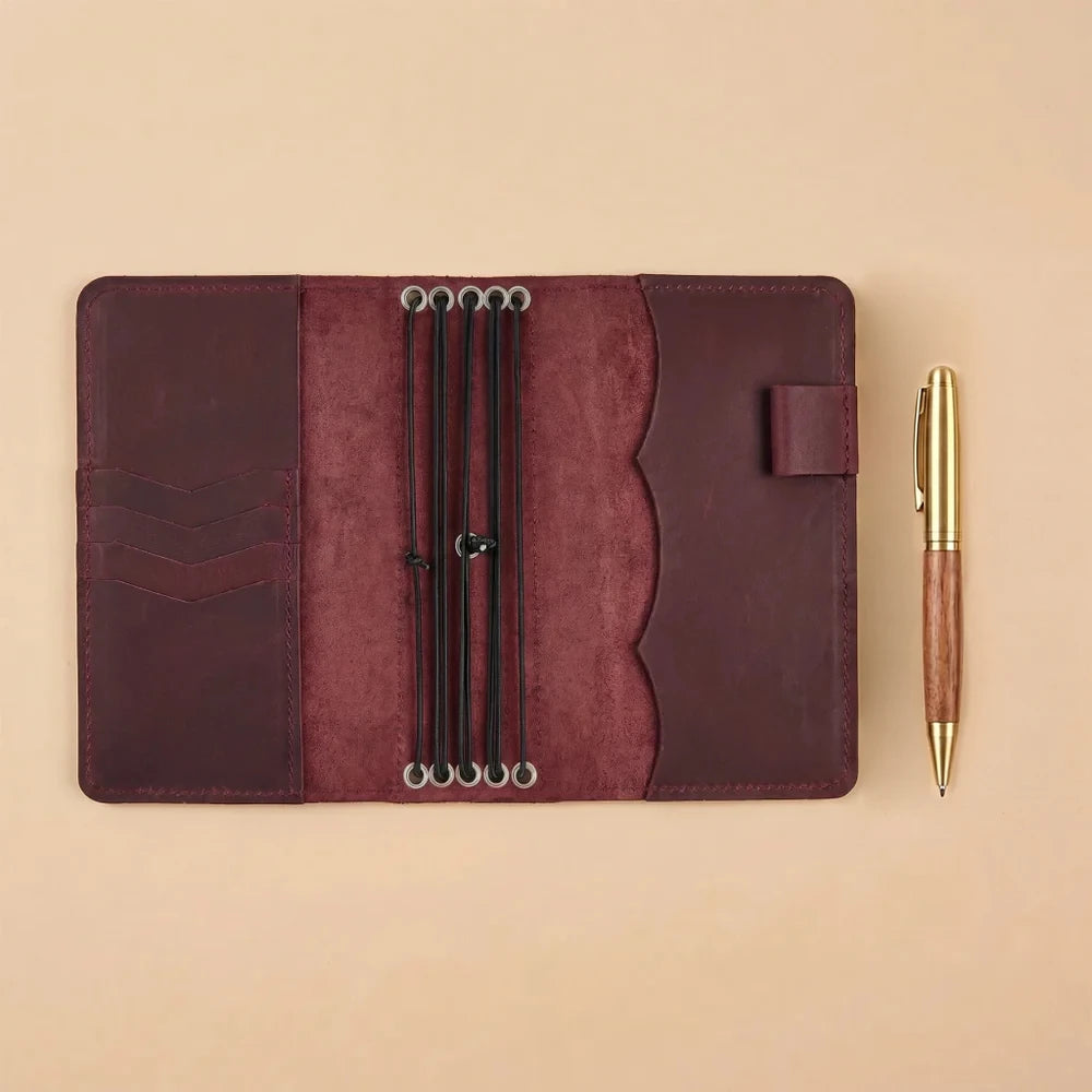 Refillable leather journal cover featuring multiple elastic straps and practical card pockets.