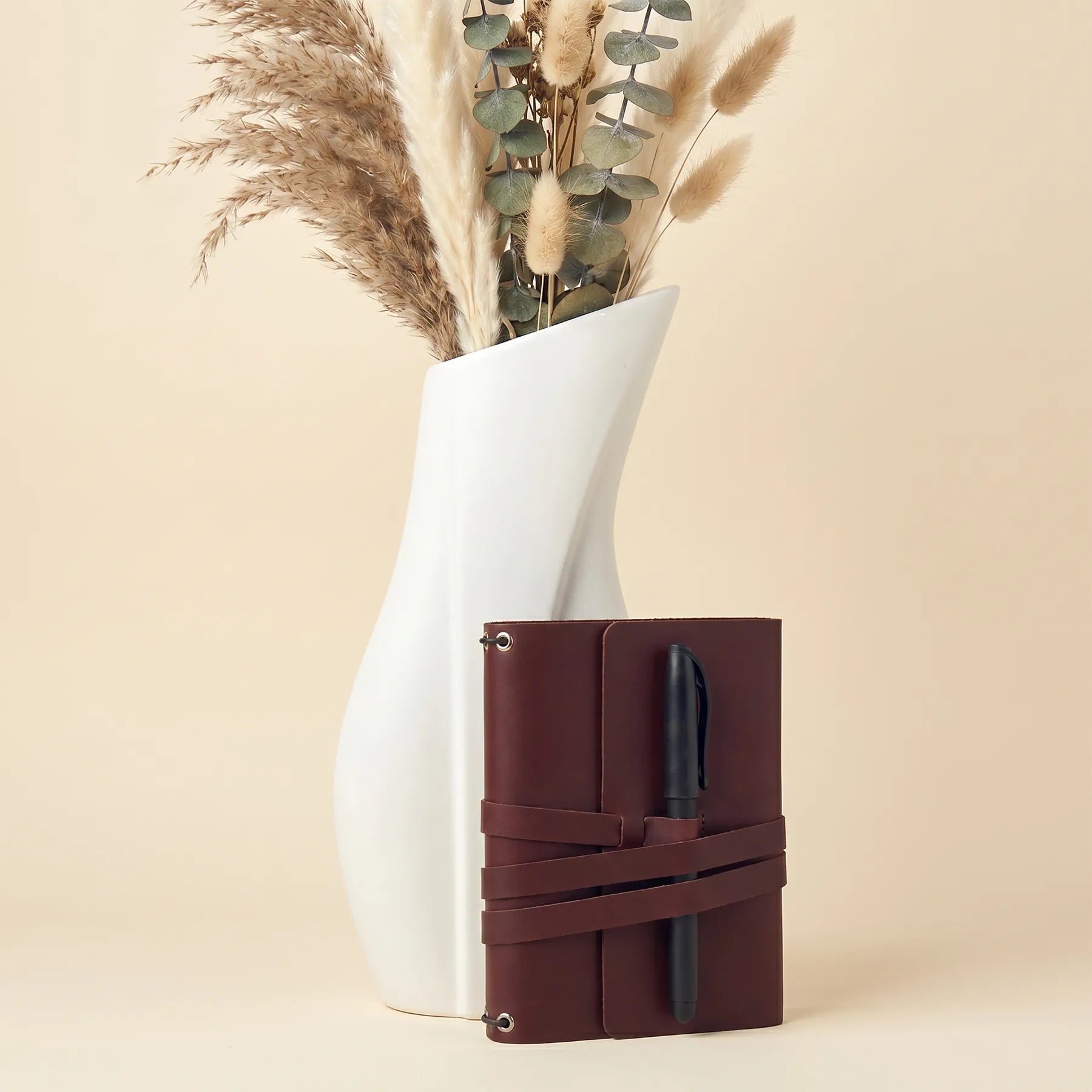 Refillable genuine leather notebook cover with practical pen holders for everyday writing.