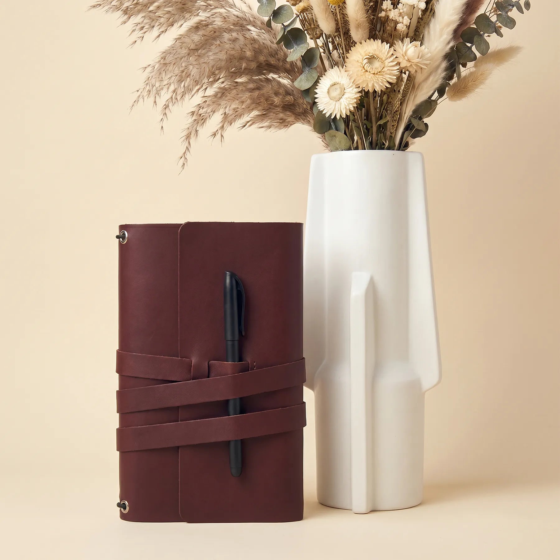 Handcrafted notebook cover made from genuine leather with secure loops for your pen.