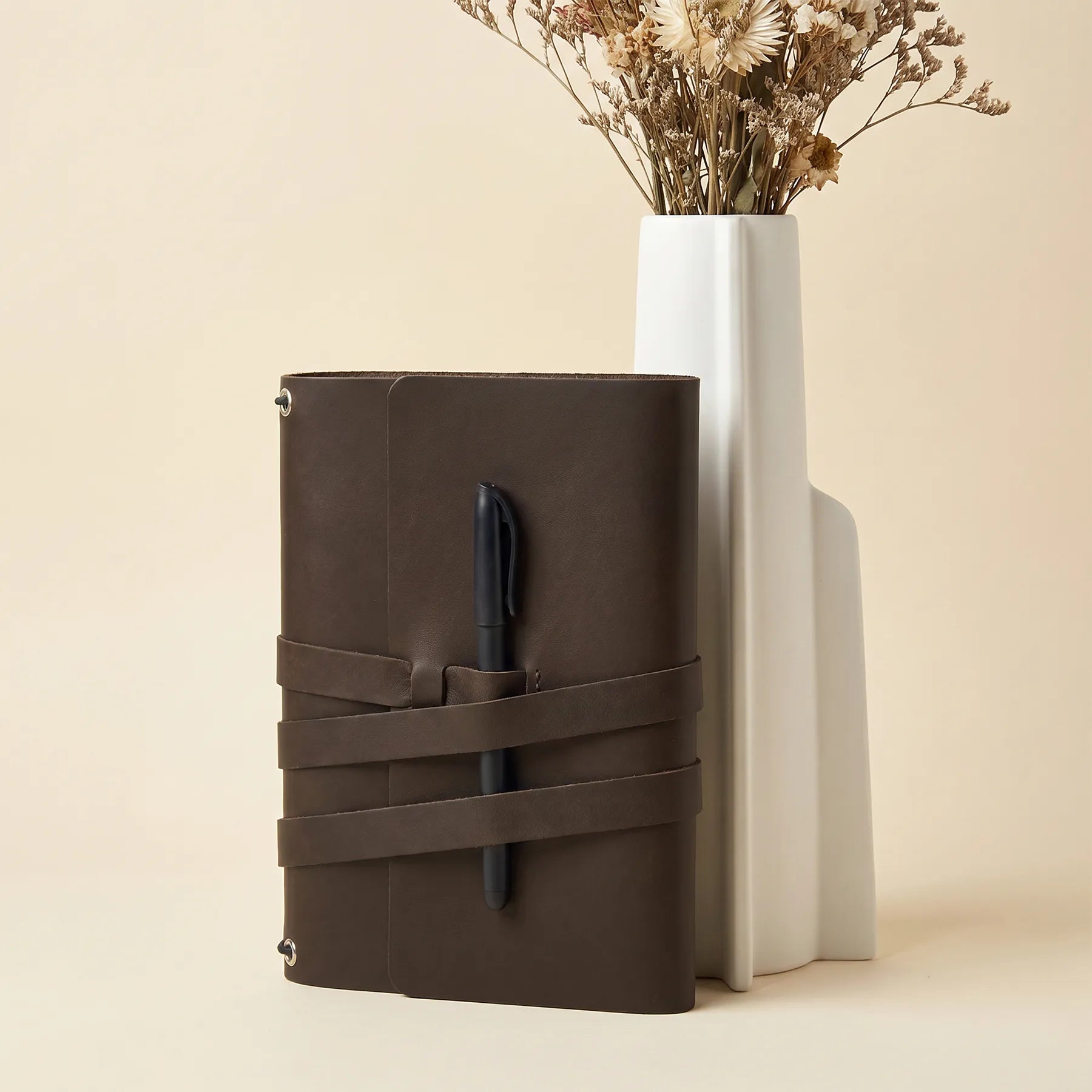 Natural leather notebook cover with pen holders designed for professional and personal use.