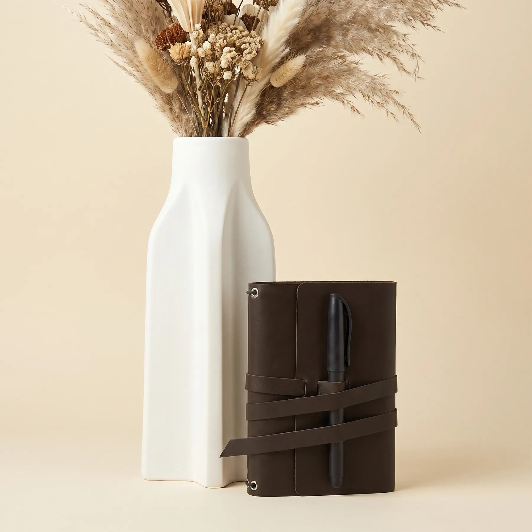 Premium leather journal cover featuring secure pen loops and timeless handcrafted craftsmanship