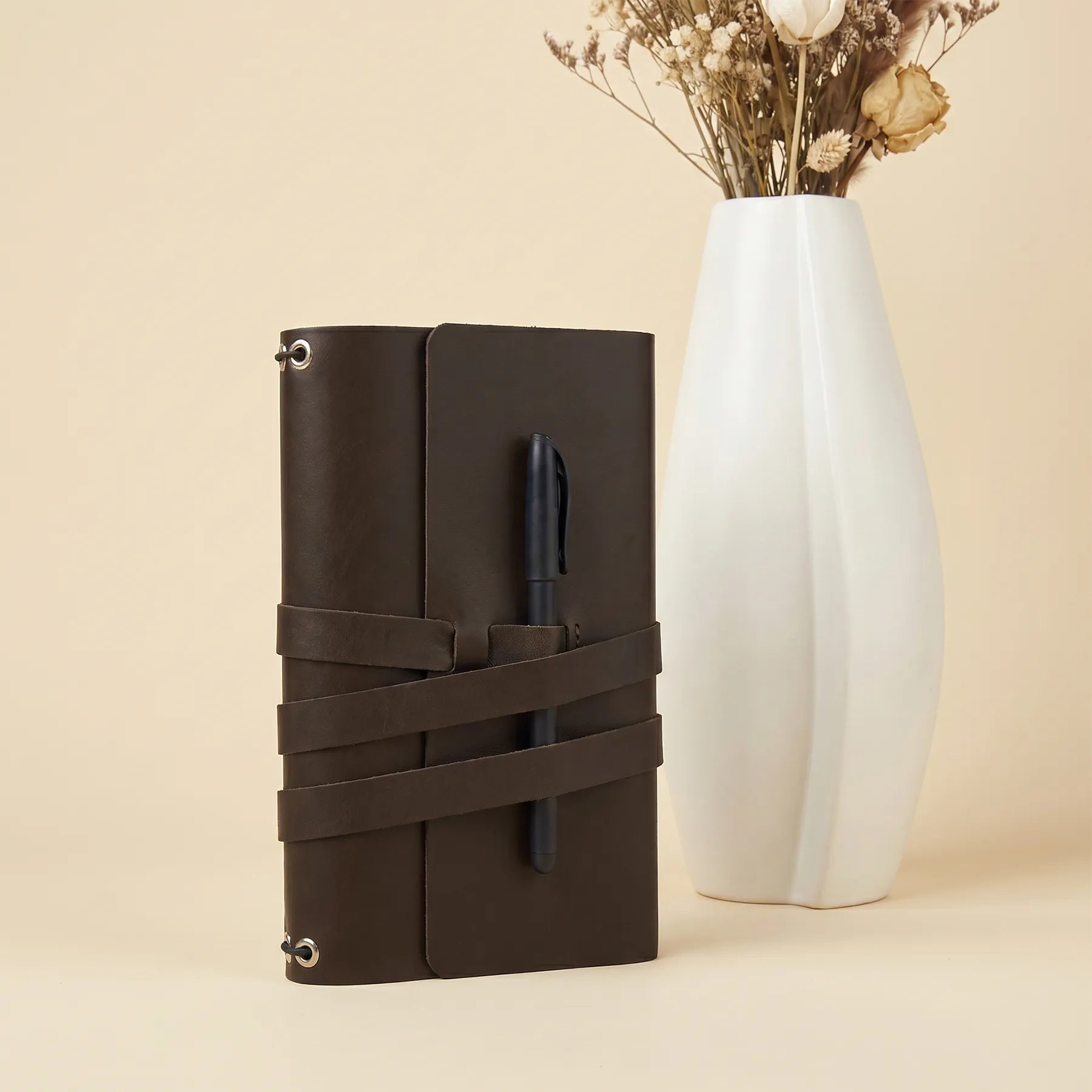 Stylish genuine leather journal cover with pen holders for office, school, and travel.