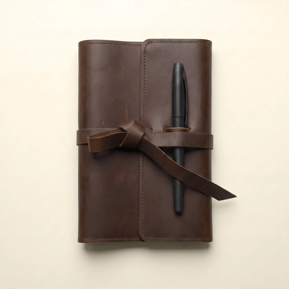Genuine leather writing journal cover with practical pockets and pen holder.