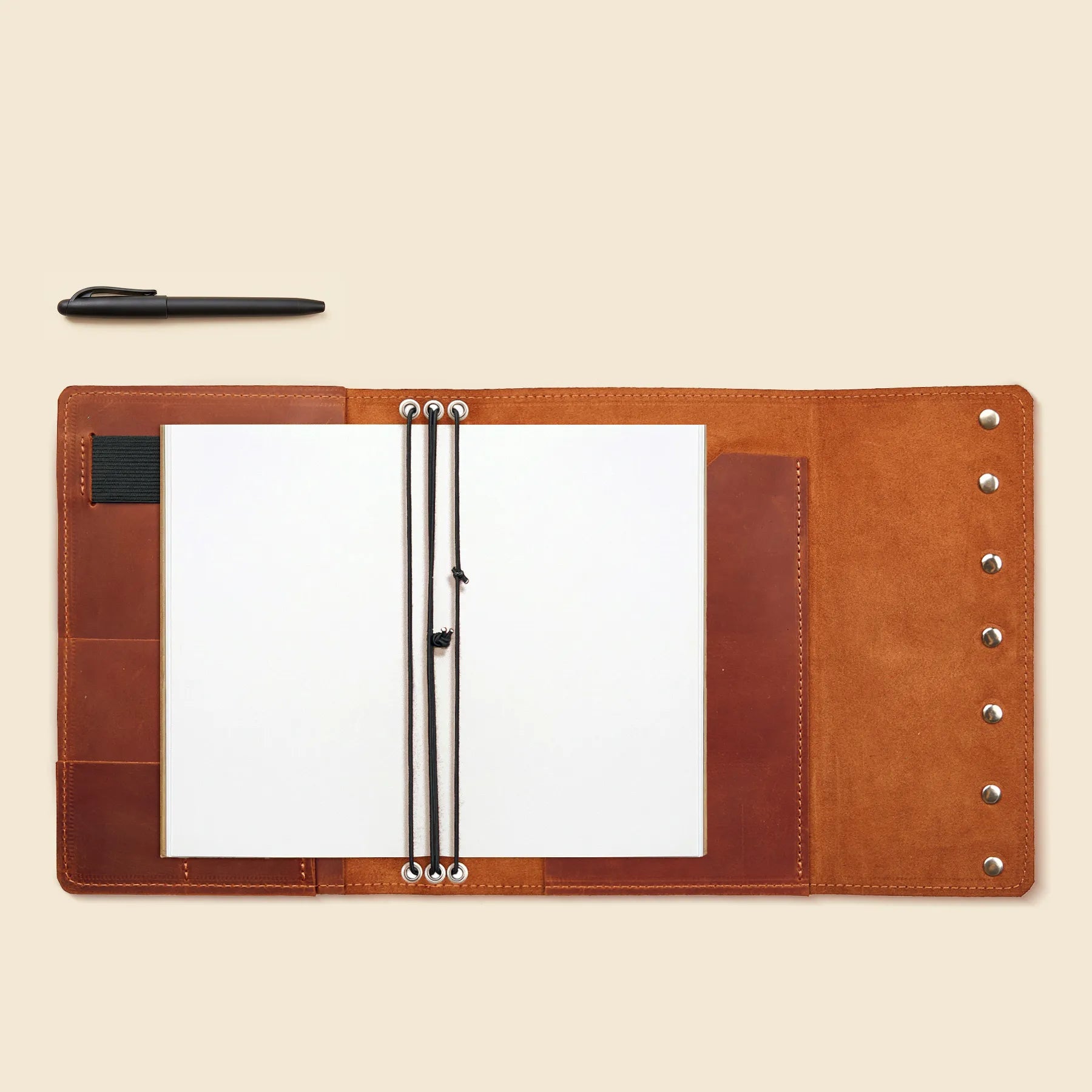 Leather planner organizer with card slots, pen loop, and elastics.