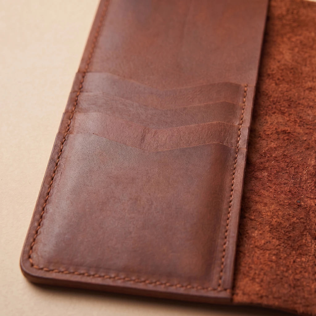 Handcrafted planner cover with elastic notebook mounting system inside