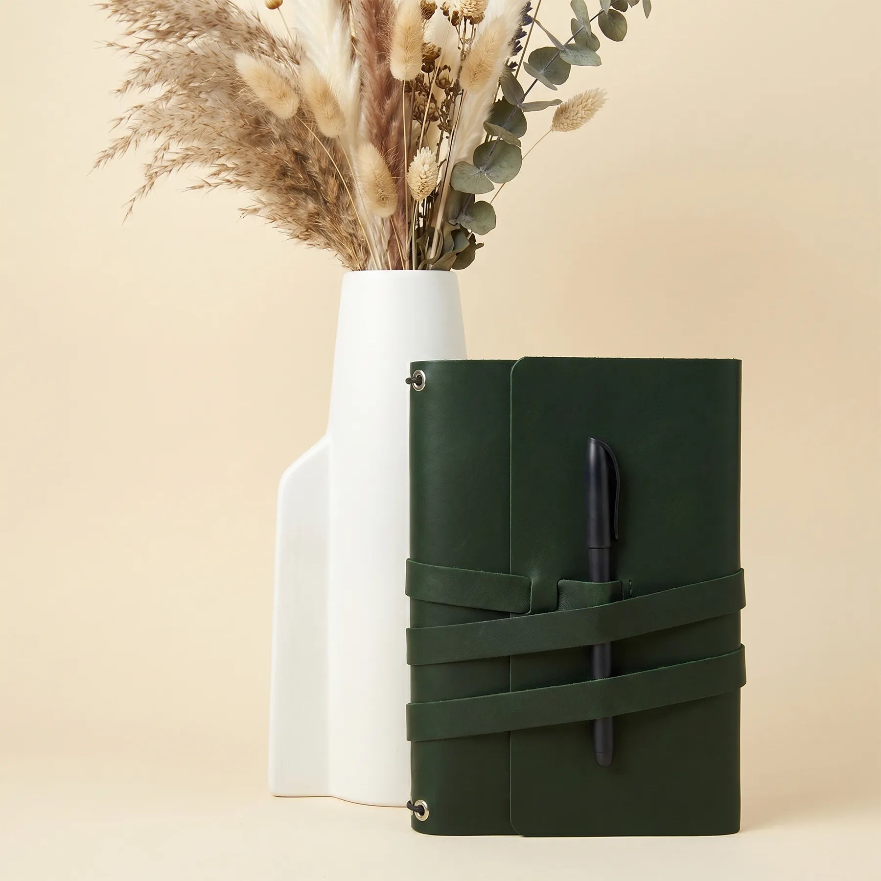 Premium refillable leather notebook cover with durable pen holders for everyday productivity.