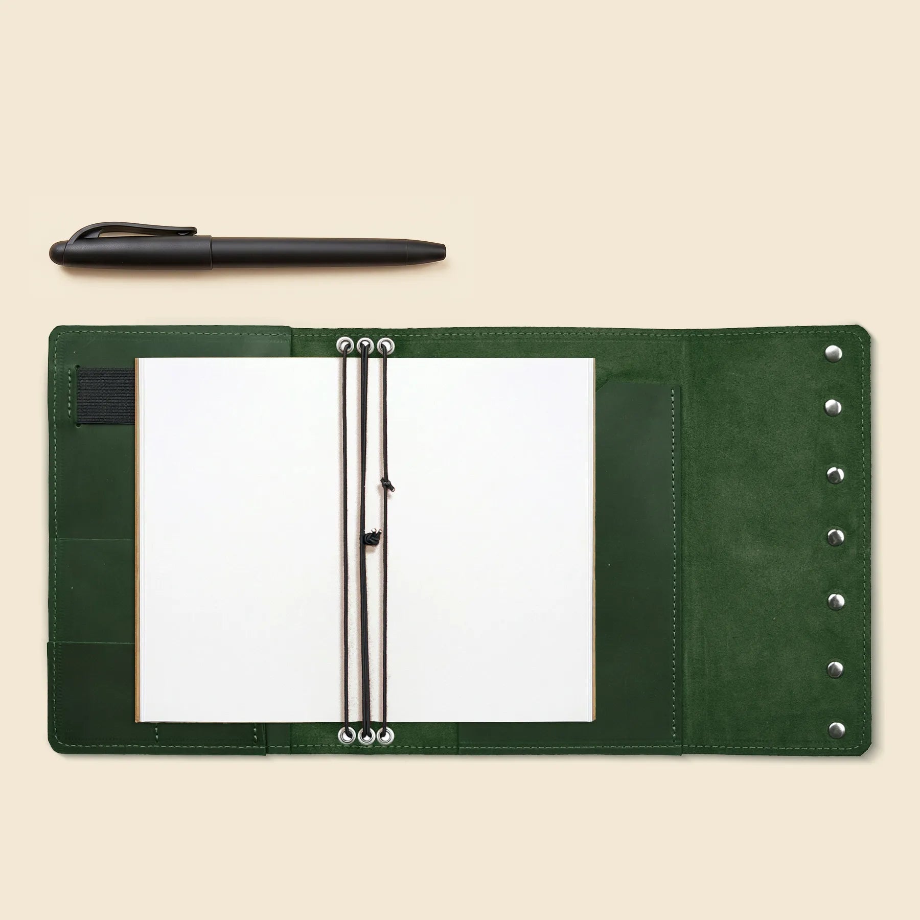 Refillable notebook cover crafted from genuine leather with inner organizers.