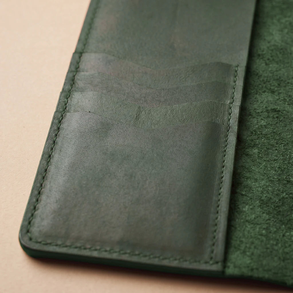 Rustic notebook organizer with integrated pen loop and pocket storage